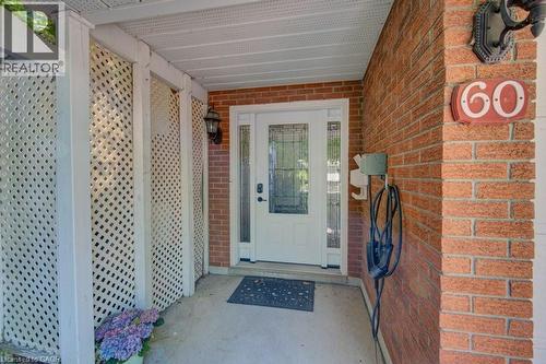 Brick facade with white latticework screens - 60 Mayfield Avenue, Waterloo, ON 