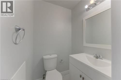 White vanity with an integrated sink and chrome fixtures - 80 Lower Canada Crescent, Kitchener, ON 