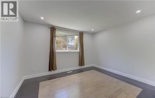 Room featuring recessed lighting, a window with white trim, and light gray wall paint - 80 Lower Canada Crescent, Kitchener, ON 