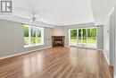 living room, gas f/p walkout - 1 - 10 Mulligan Lane, Wasaga Beach, ON  - Indoor Photo Showing Living Room With Fireplace 