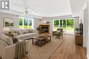 virtual staging - 1 - 10 Mulligan Lane, Wasaga Beach, ON  - Indoor Photo Showing Living Room With Fireplace 