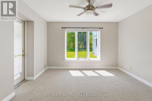 primary suite with walkout to patio, double closet - 1 - 10 Mulligan Lane, Wasaga Beach, ON - Indoor Photo Showing Other Room