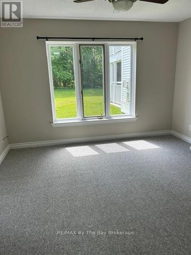 Primary suite new carpet - 1 - 10 Mulligan Lane, Wasaga Beach, ON - Indoor Photo Showing Other Room