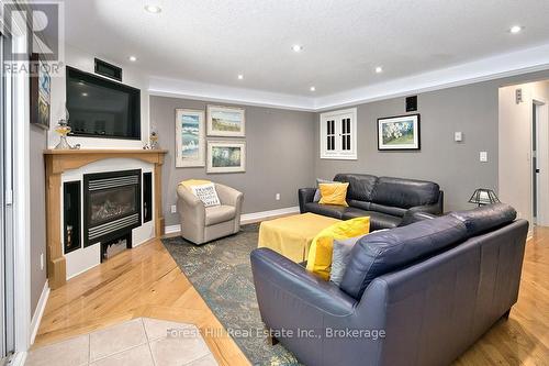 Family Room with cozy propane fireplace - 157 Glen Fiddish Road, West Grey, ON - Indoor Photo Showing Living Room With Fireplace