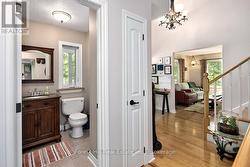 Main floor Powder Room off Foyer - 