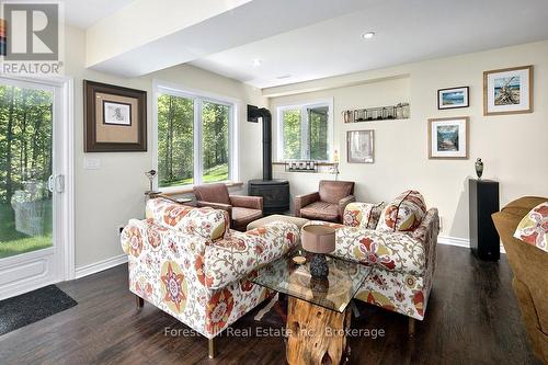 Lower level with lots of natural light & fireplace - 157 Glen Fiddish Road, West Grey, ON - Indoor Photo Showing Other Room