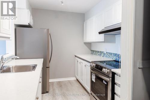 Kitchen with new Stove, Fridge and Hoodfan - 406 - 280 Brittany Drive, Ottawa, ON 