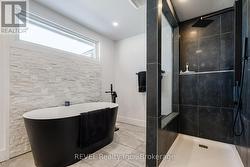 Main floor bathroom with soaker tub - 