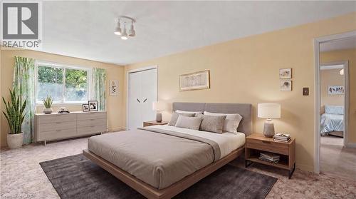 Spacious bedroom featuring light-colored walls and carpet flooring - 2068 Wellington Avenue, Burlington, ON 