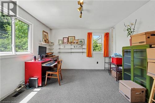 Expansive room featuring light gray carpeting, crisp white walls, and multiple windows - 2068 Wellington Avenue, Burlington, ON 