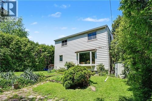 Two-story exterior with horizontal siding and multiple windows, including a large bay window - 2068 Wellington Avenue, Burlington, ON 