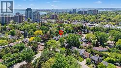 Aerial perspective highlighting a residential neighborhood with extensive tree coverage - 