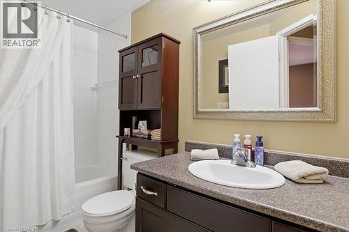 Vanity with an oval undermount sink and polished chrome faucet - 20 Ridgeway Crescent, Kitchener, ON - Indoor Photo Showing Bathroom