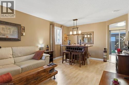 Open-concept living space featuring light  flooring, a window with drapery, and a recessed ceiling - 20 Ridgeway Crescent, Kitchener, ON - Indoor Photo Showing Living Room
