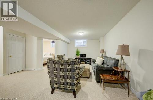 Finished lower level featuring neutral carpeting and recessed lighting - 7 Housler Lane, Cambridge, ON 