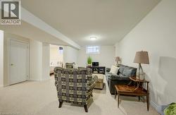 Finished lower level featuring neutral carpeting and recessed lighting - 