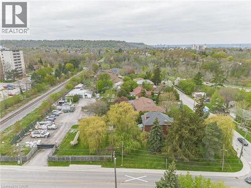 Aerial perspective showcasing a verdant landscape with established trees and surrounding properties - 262-270-276 Hixon Road, Hamilton, ON 