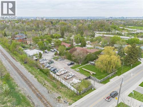 Expansive lot featuring a gravel surface, perimeter fencing, and direct road frontage - 262-270-276 Hixon Road, Hamilton, ON 