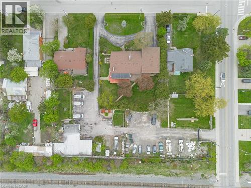 Extensive property featuring multiple structures, paved parking areas, and mature trees - 262-270-276 Hixon Road, Hamilton, ON 