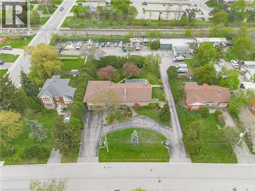 Spacious property featuring multiple structures, mature trees, and extensive paved driveways - 262-270-276 Hixon Road, Hamilton, ON 