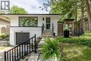 Modern facade featuring white brick, horizontal siding, and a prominent picture window - 22 Charlotte Crescent, Kitchener, ON 