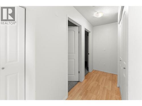 Bright hallway connecting the living space to bedrooms and bathroom, and a clean, functional layout. - 555 Dalgleish Drive Unit# 412, Kamloops, BC - Indoor Photo Showing Other Room