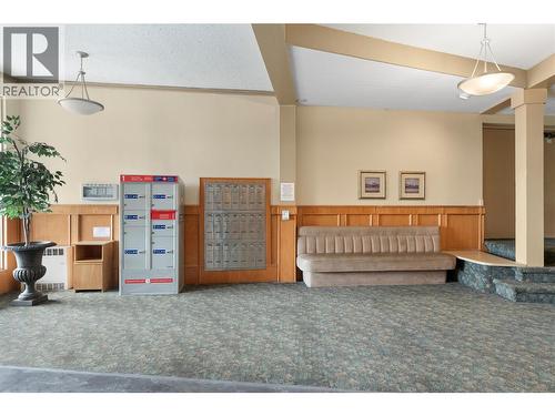 Welcoming secured lobby area featuring mailboxes, seating space, and controlled building access for added convenience and peace of mind. - 555 Dalgleish Drive Unit# 412, Kamloops, BC - Indoor Photo Showing Other Room
