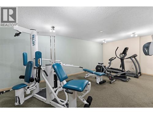 Well-equipped fitness room featuring cardio and weight equipment for convenient in-building workouts. - 555 Dalgleish Drive Unit# 412, Kamloops, BC - Indoor Photo Showing Gym Room