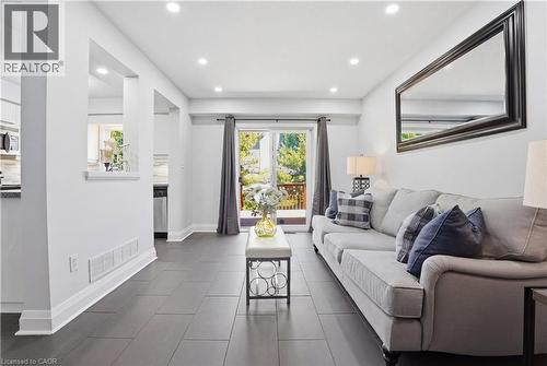 Bright living space featuring dark tile flooring and recessed ceiling lighting - 7 Upper Mercer Street Unit# G30, Kitchener, ON - Indoor Photo Showing Living Room