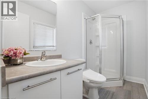 Bathroom featuring a vanity with a white basin sink, polished chrome faucet, and gray countertop - 7 Upper Mercer Street Unit# G30, Kitchener, ON - Indoor Photo Showing Bathroom