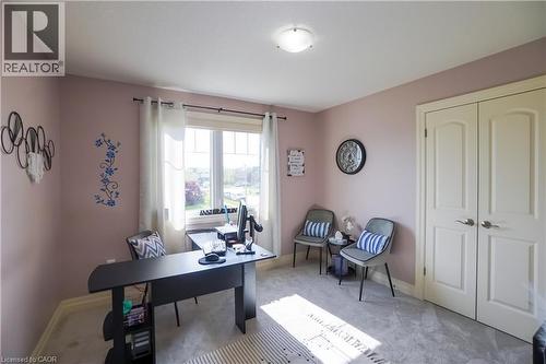 Bright room with neutral carpet flooring and a large double-pane window - 365 Poldon Drive, Norwich, ON 