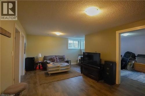 Lower-level space featuring wood-finish flooring, recessed lighting, and light-toned walls - 365 Poldon Drive, Norwich, ON 