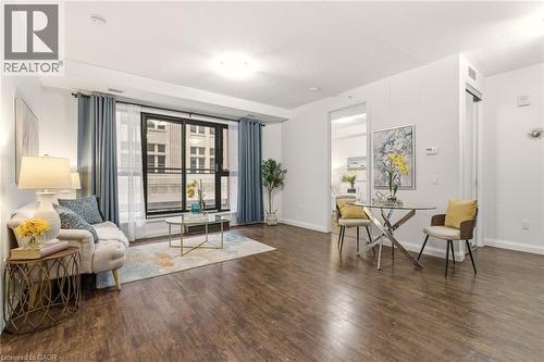 Bright open-concept living area with balcony - 112 King Street E Unit# 408, Hamilton, ON 