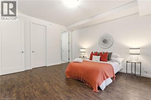 Spacious primary bedroom with large windows, 4PC Ensuite & Closet - 112 King Street E Unit# 408, Hamilton, ON 