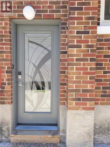 Entry door with decorative glass insert and smart lock - 153 Arnold Street, Kitchener, ON 