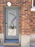 Entry door with decorative glass insert and smart lock - 153 Arnold Street, Kitchener, ON 