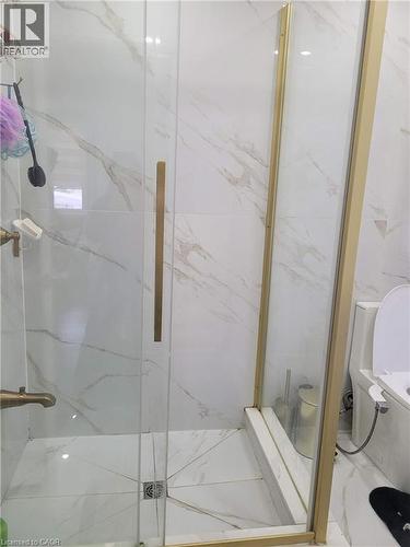 Frameless glass shower enclosure with gold-tone hardware - 153 Arnold Street, Kitchener, ON 