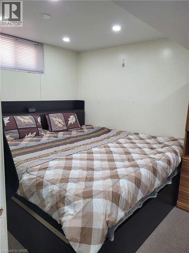 Recessed ceiling lighting illuminates this room, featuring light-toned walls and carpet flooring - 153 Arnold Street, Kitchener, ON 