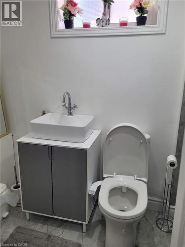 Contemporary vanity with a rectangular vessel sink and chrome faucet - 153 Arnold Street, Kitchener, ON 