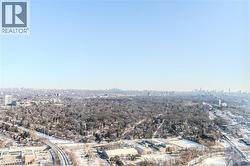Expansive aerial perspective showcasing a broad urban landscape with a distant city skyline - 