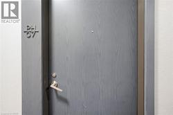Entry door with a wood-grain finish and modern hardware - 