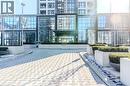 Modern building exterior featuring extensive glass facades and a prominent recessed entrance - 7 Mabelle Avenue Unit# Ph07, Toronto, ON 