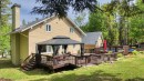 Face arrière - 702 Rue Des Pierrailles, Sainte-Adèle, QC  - Outdoor With Deck Patio Veranda With Exterior 