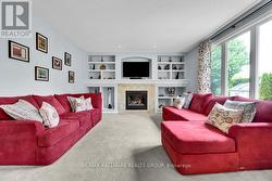 Large windows overlooking the park-like backyard. - 