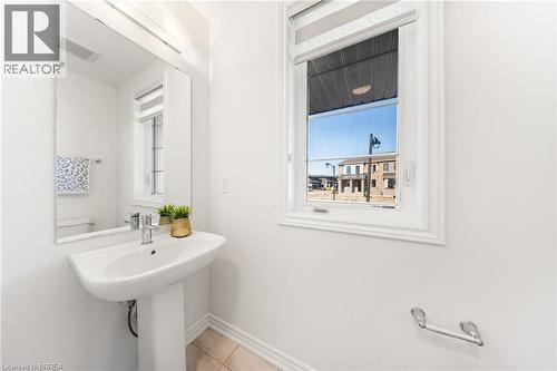 Bathroom featuring plenty of natural light and light tile patterned floors - 1 Bee Crescent, Brantford, ON 