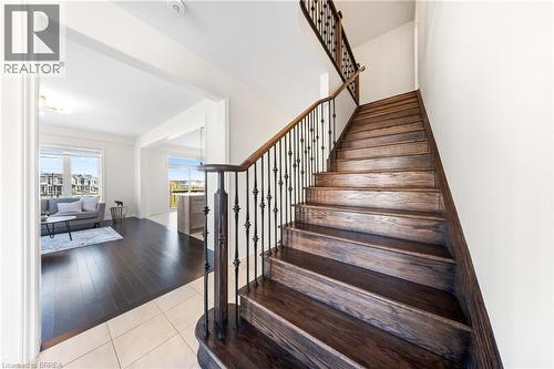 Staircase with tile patterned floors - 1 Bee Crescent, Brantford, ON 
