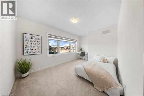 Carpeted bedroom with baseboards - 1 Bee Crescent, Brantford, ON 