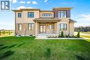 Rear view of property featuring covered porch, a yard, brick siding, and french doors - 1 Bee Crescent, Brantford, ON 
