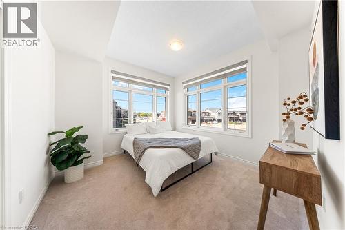 Bedroom featuring light carpet and baseboards - 1 Bee Crescent, Brantford, ON 