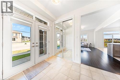 Doorway to outside with tile patterned flooring and french doors - 1 Bee Crescent, Brantford, ON 